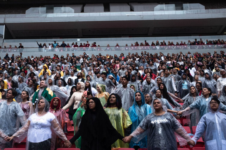 Believers pray during the event "The Send", at the Mane Garrincha Stadium, in Brasilia. The Send is an event that gathers evangelical missionaries to train them and raise money for evangelization of other people, within and outside Brazil. This event happened in three different stadiums in the country at the same time and it was formed by a conglomerate of churches from different nationalities. Brazil is one of the countries with the most evangelical missionaries in the world. One of the reasons for this is the high number of uncontacted indigenous communities. According to the bible, Jesus will return only when all the people “know His word”. Brasilia, Brazil. February 08, 2020. Photo: Ian Cheibub