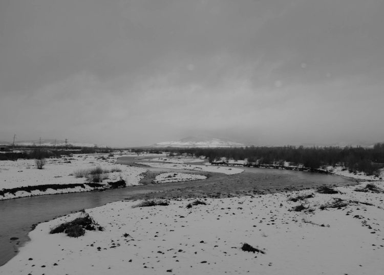 The Liakhvi River flows through the Zone of Fear, crossing into the territory of occupied South Ossetia, past empty, abandoned fields.